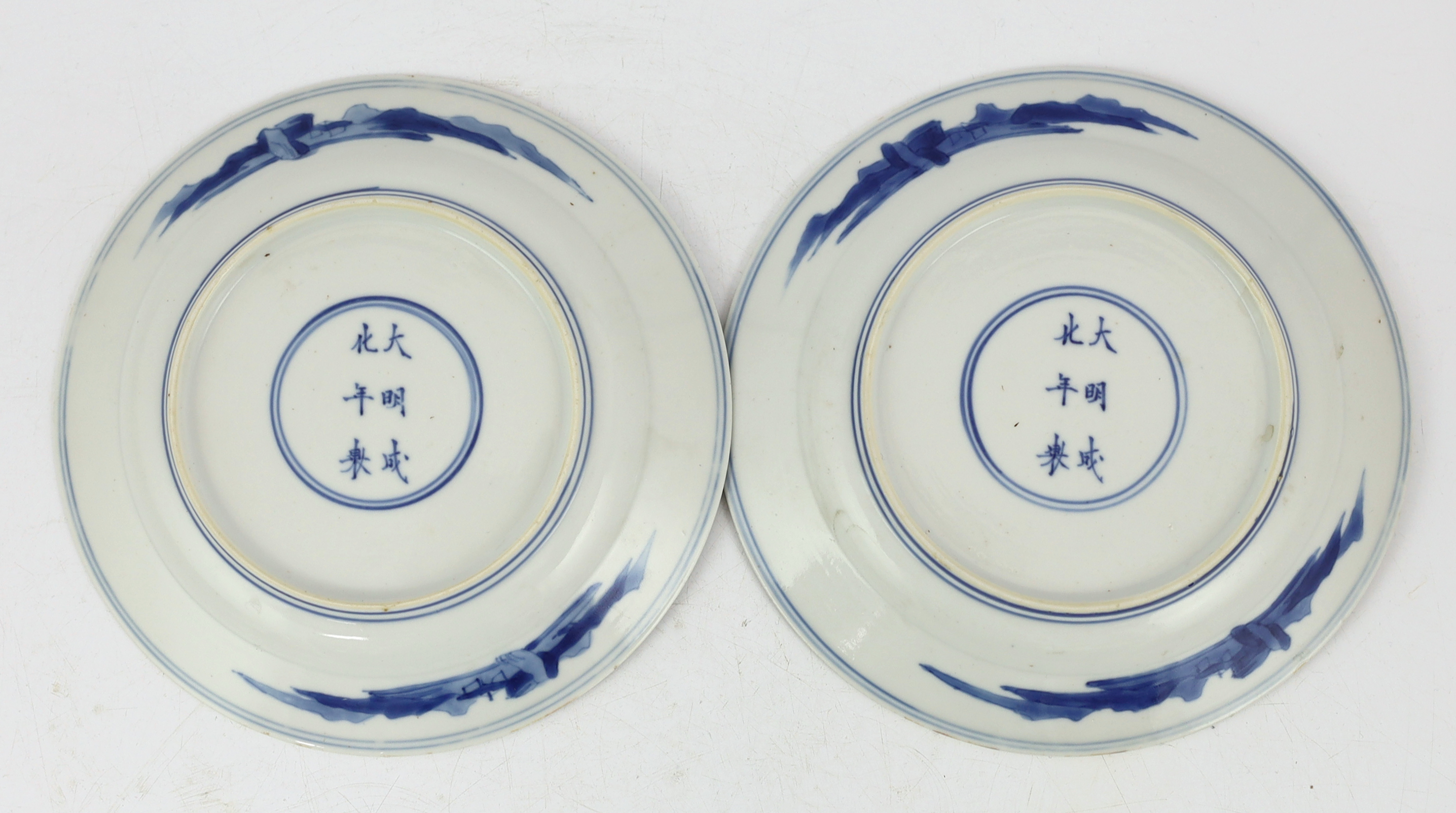 A pair of Chinese blue and white small plates, Kangxi period, hairline cracks to one plate.